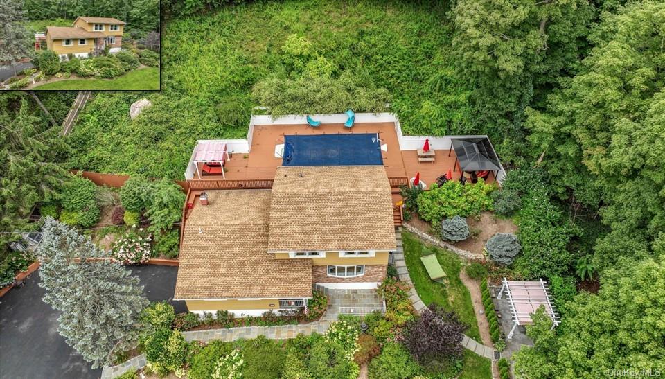 an aerial view of a house with outdoor space