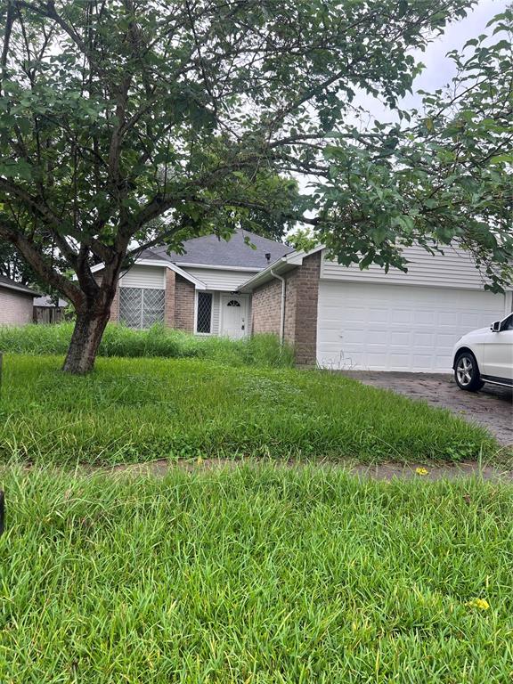 a view of house with yard