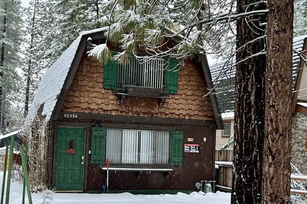 a view of a house with a tree