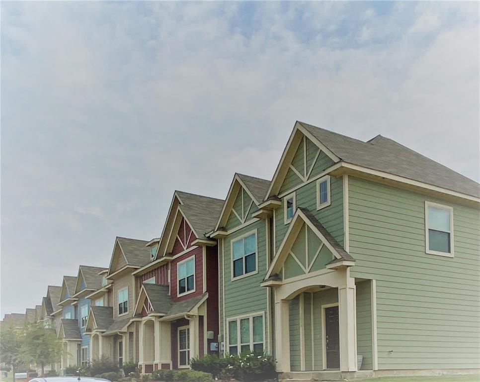 a view of a big house with windows