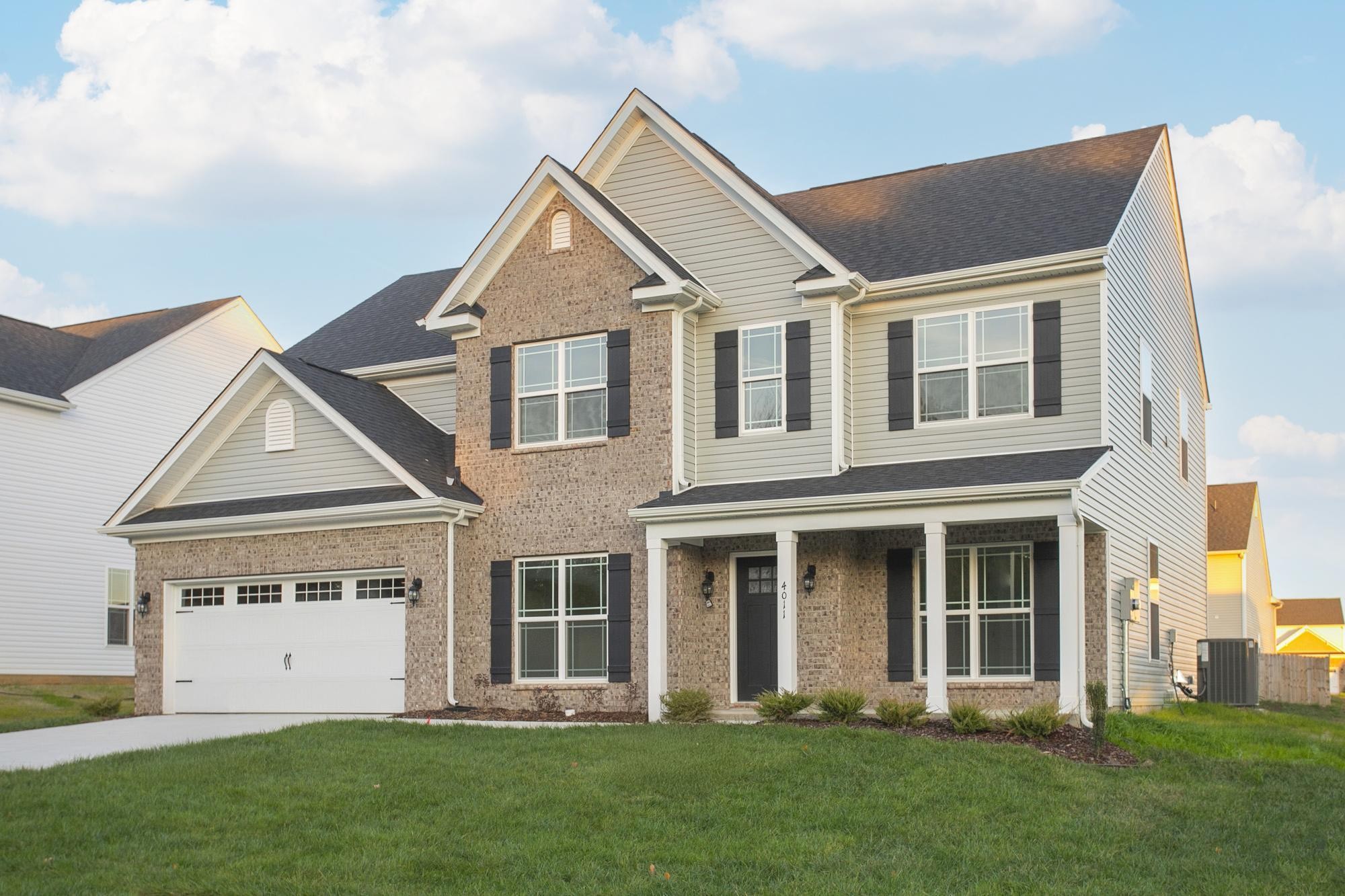 front view of a house with a yard