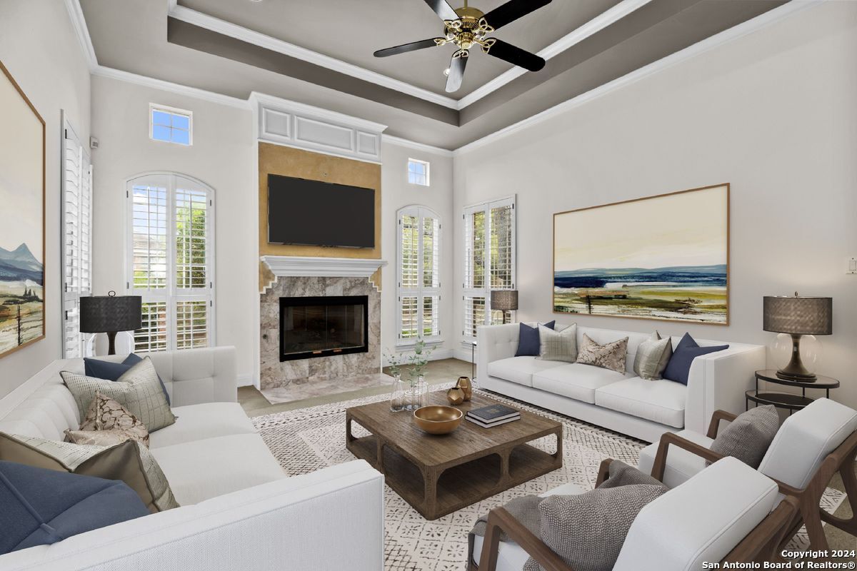 a living room with furniture and a fireplace