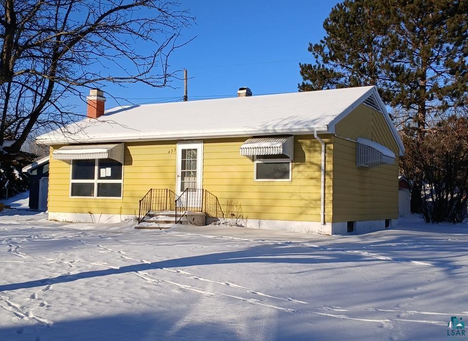 View of snow covered property