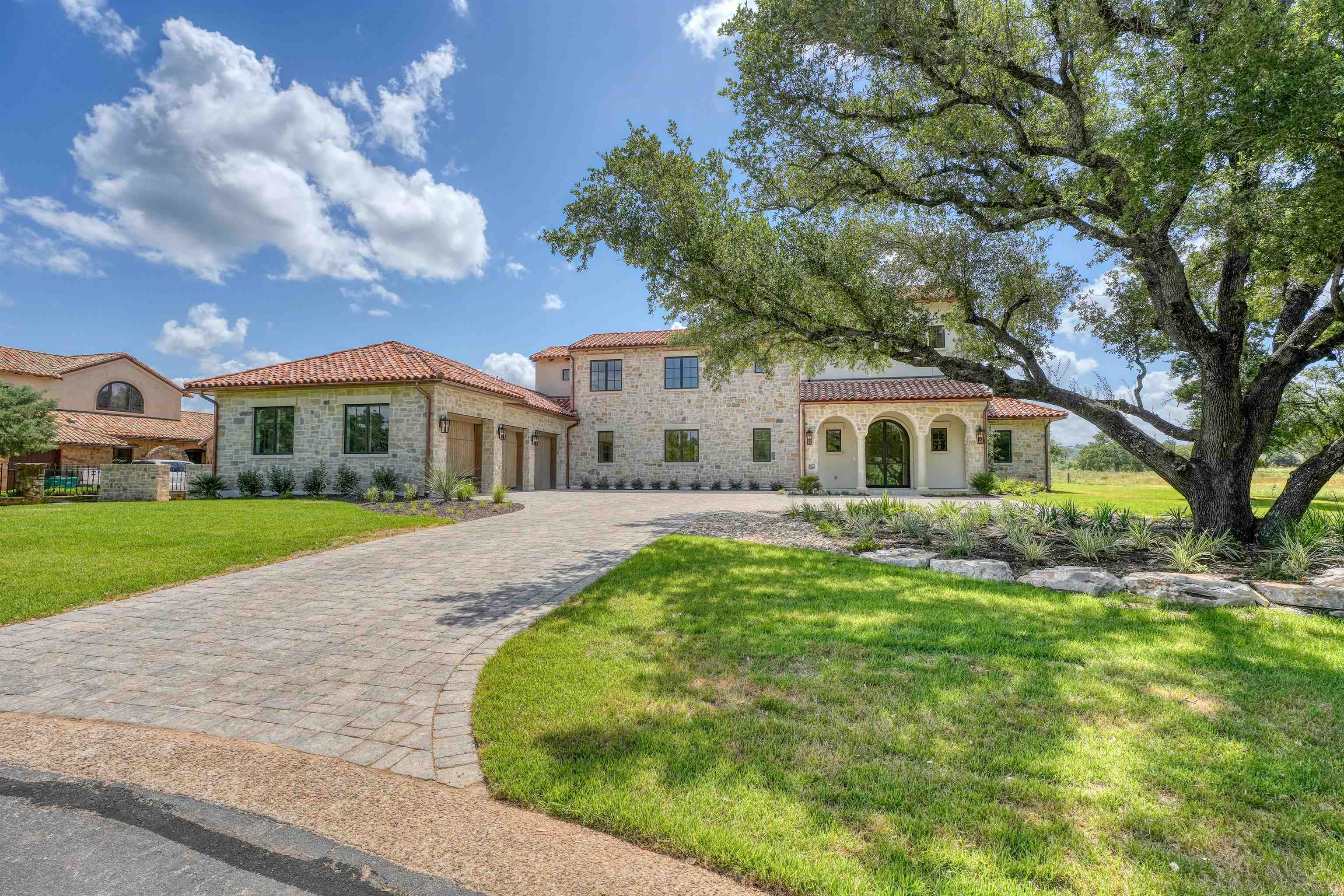 a front view of house with yard and green space