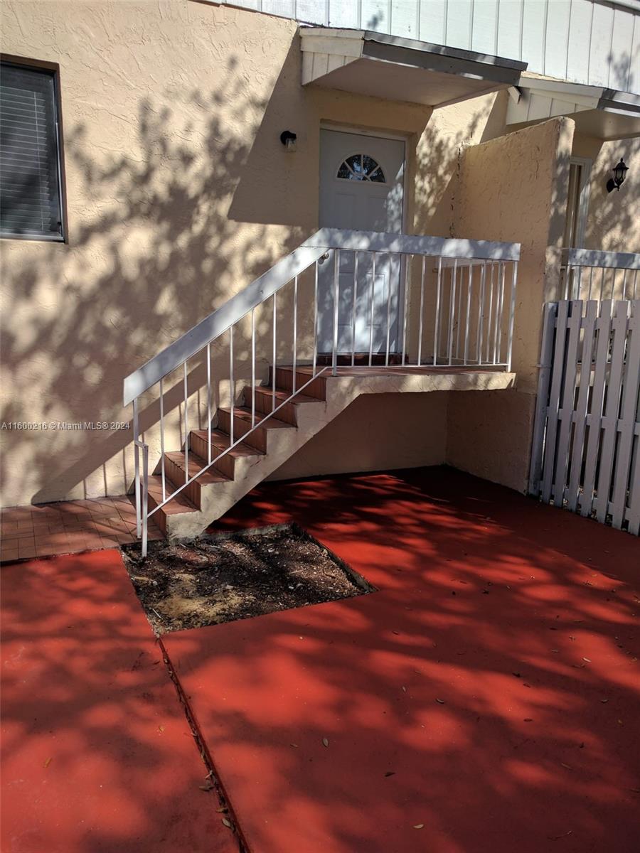 a view of balcony with wooden floor