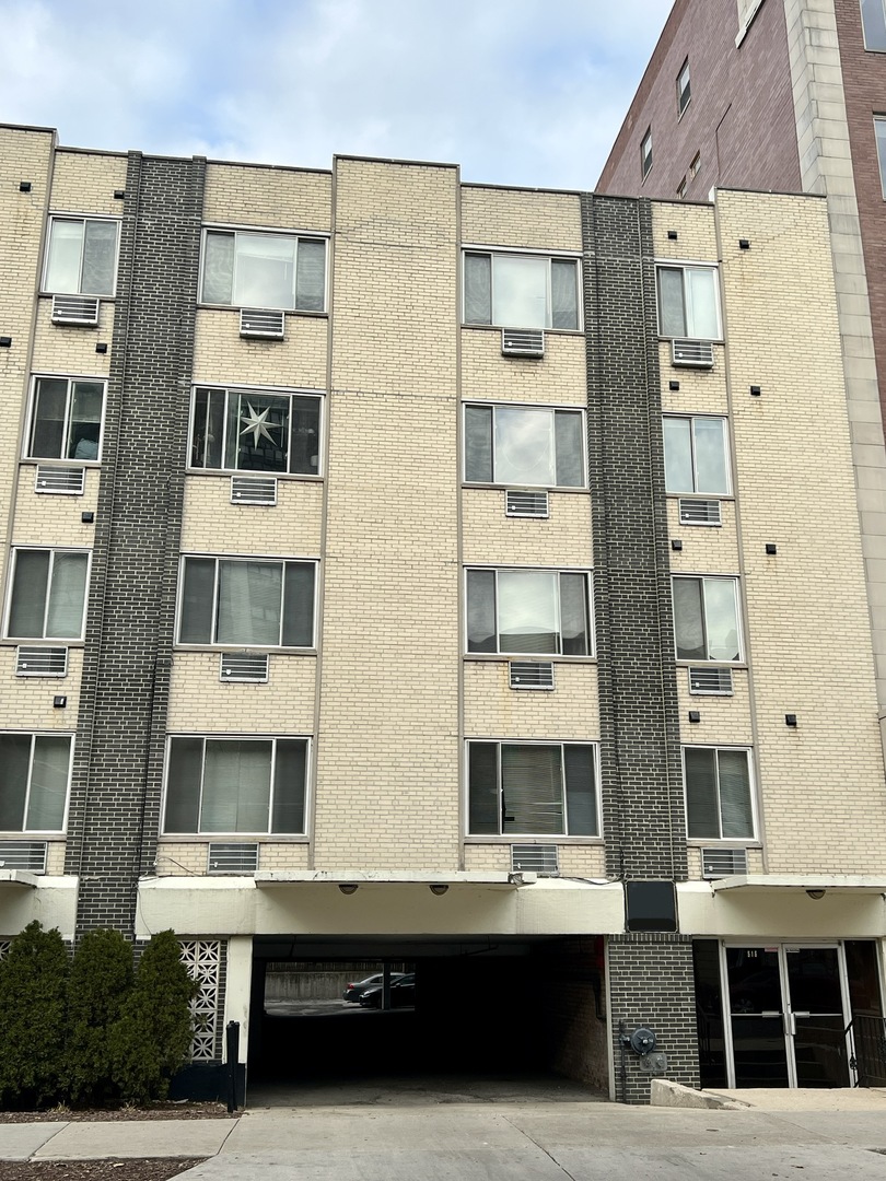 a front view of a building with a lot of windows