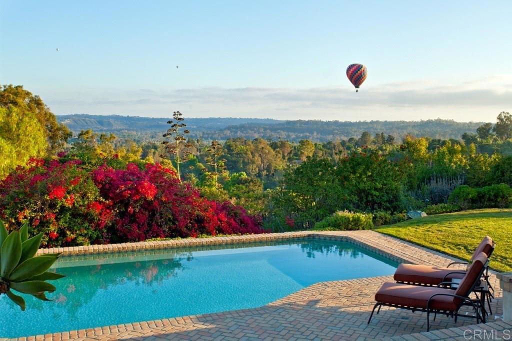 a view of a swimming pool and lounge chair