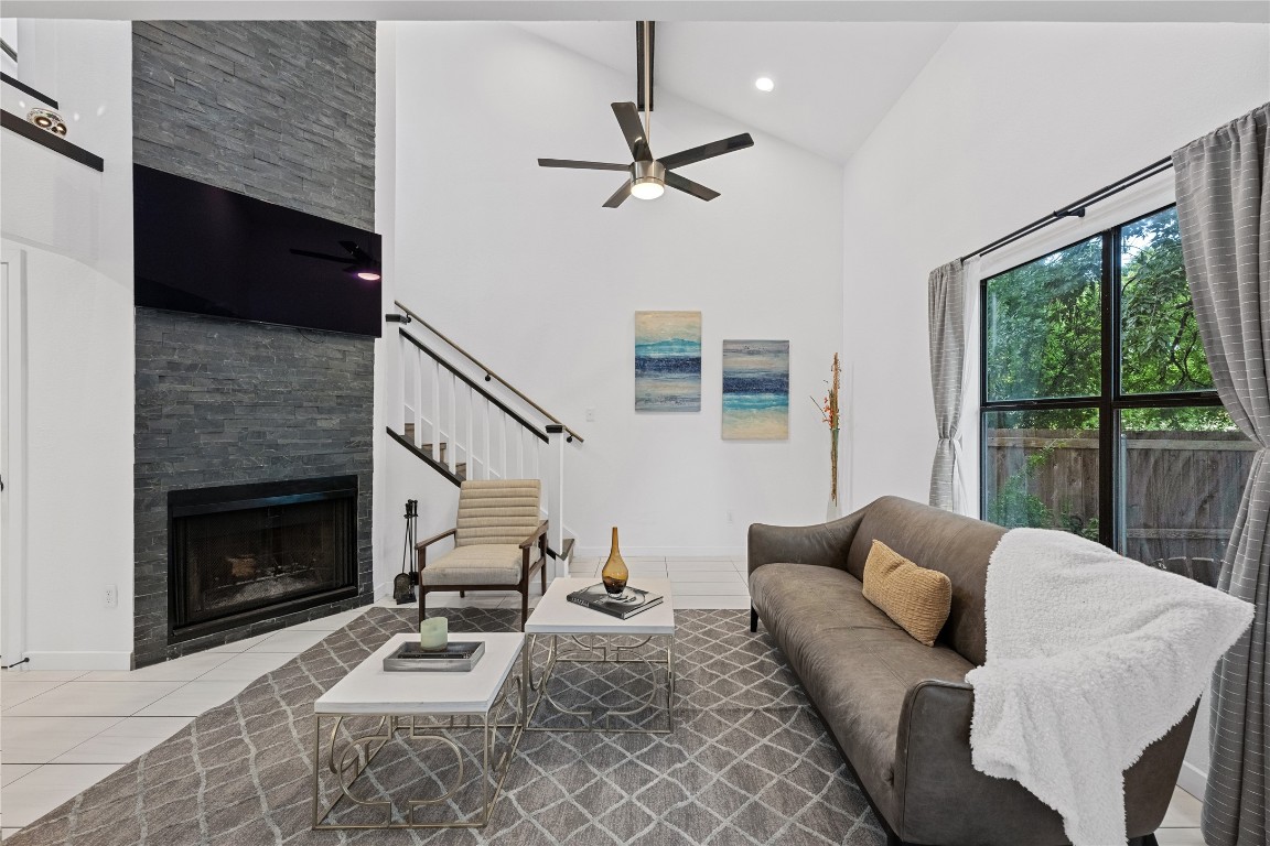 a living room with furniture fireplace and a flat screen tv