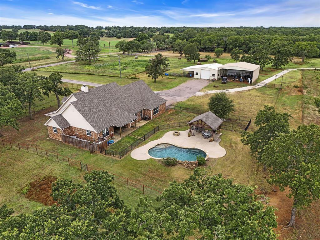 an aerial view of a house with a garden