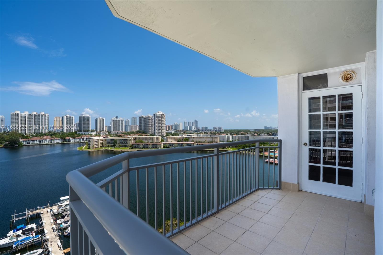 a view of balcony with furniture and city view