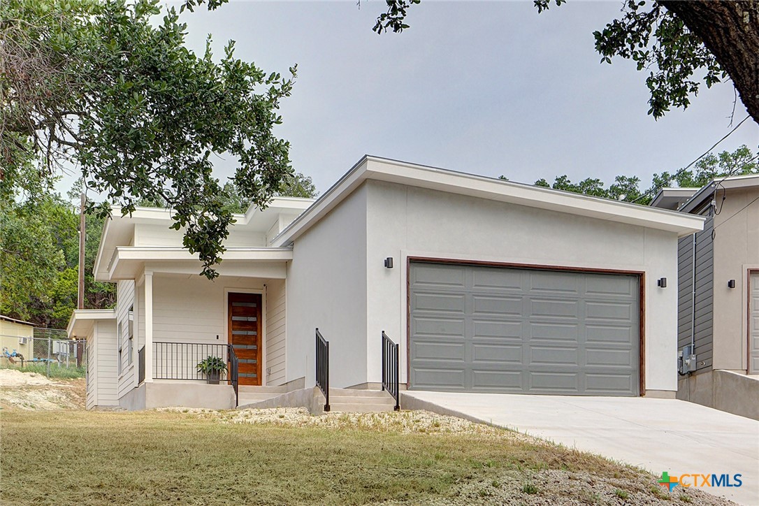 a front view of house with garage