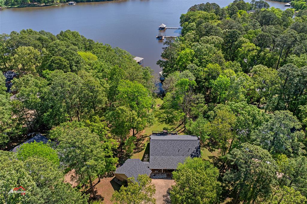 an aerial view of a house with garden space and sitting space