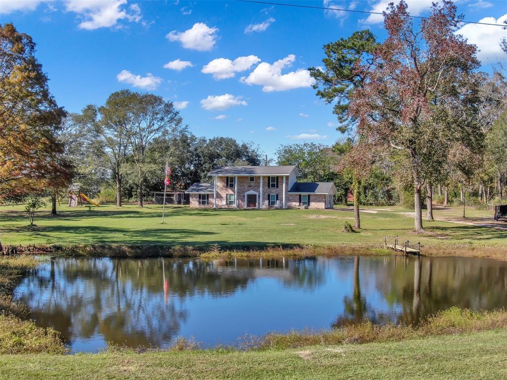 a view of a lake with a house in the background