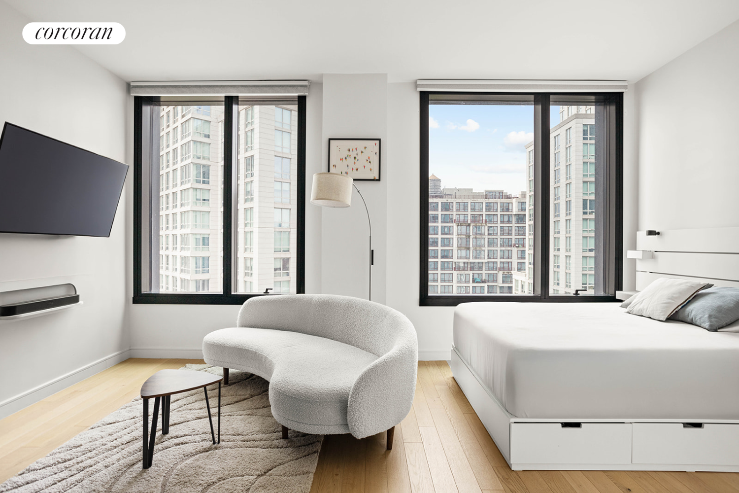 a bedroom with a bed and large window