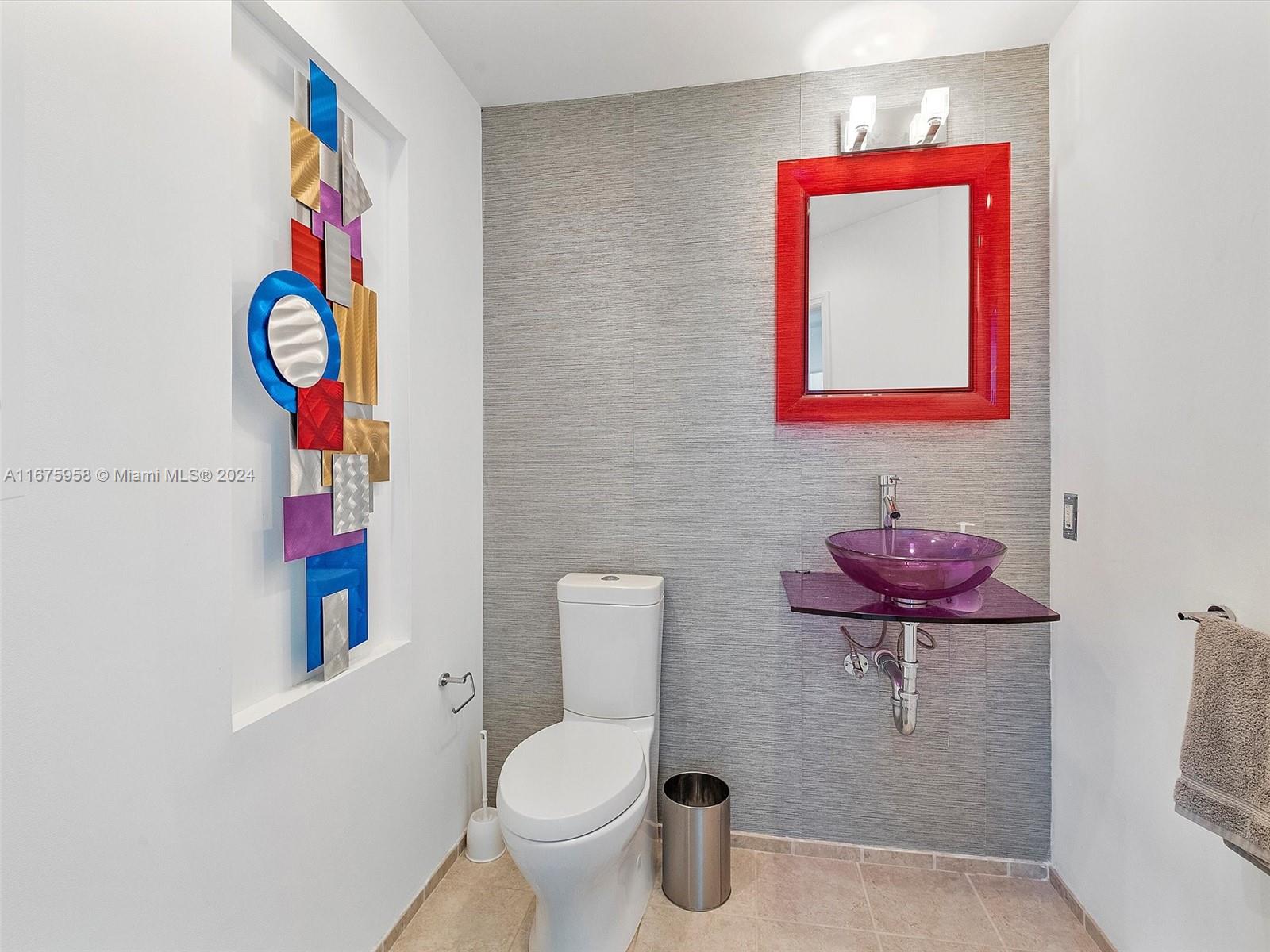 a bathroom with a toilet a sink and a shower