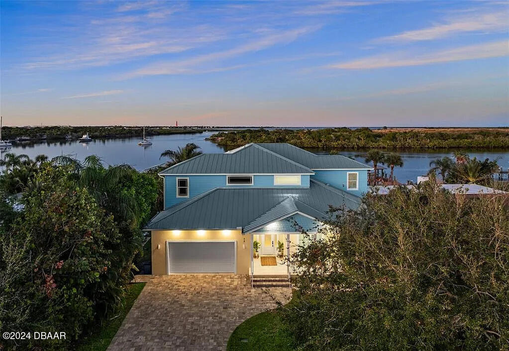 aerial view of a house with a yard