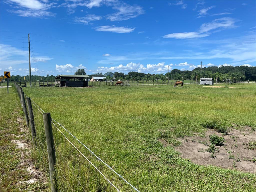 a view of a lake with a big yard