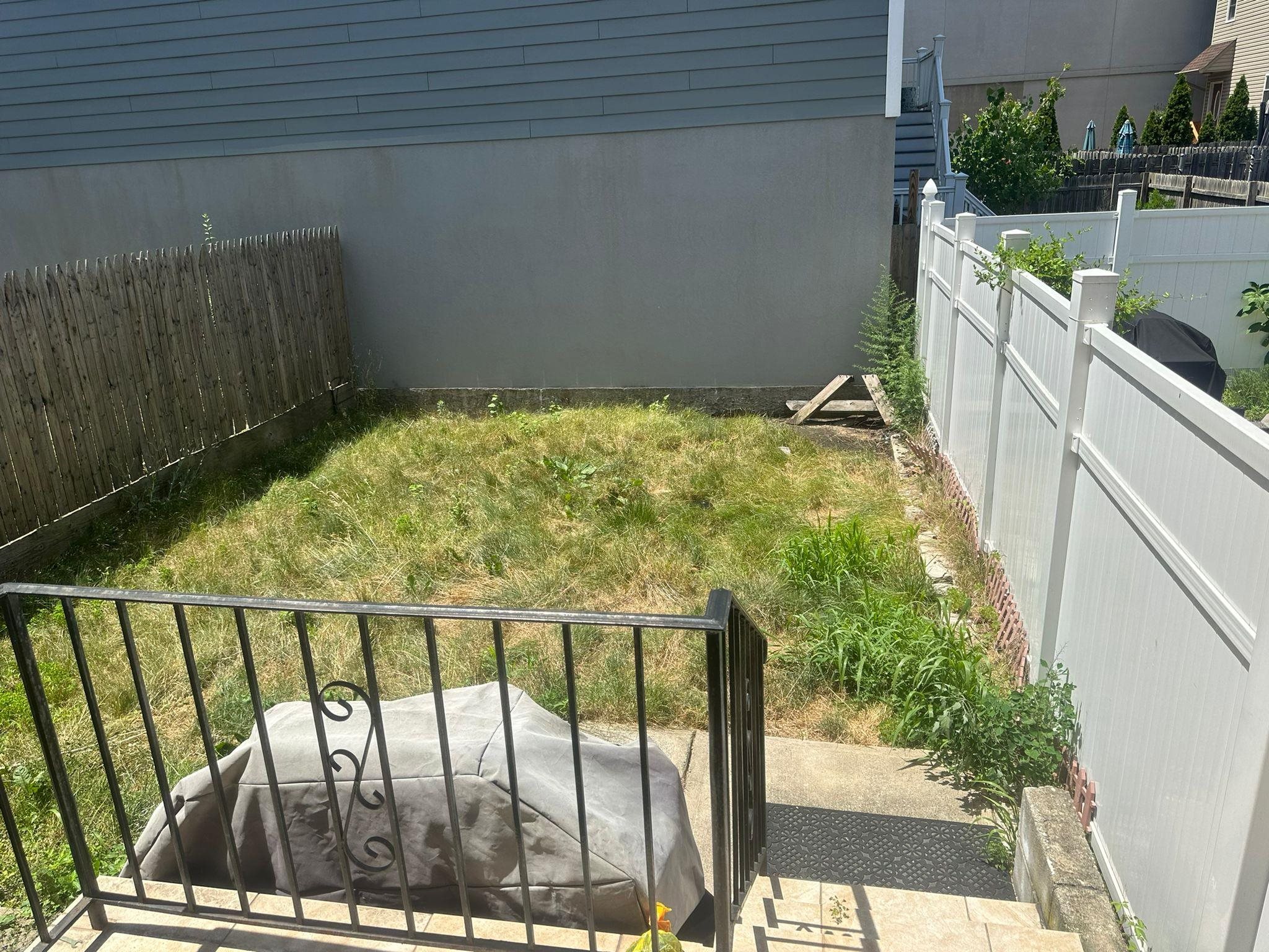 a balcony with next to a yard