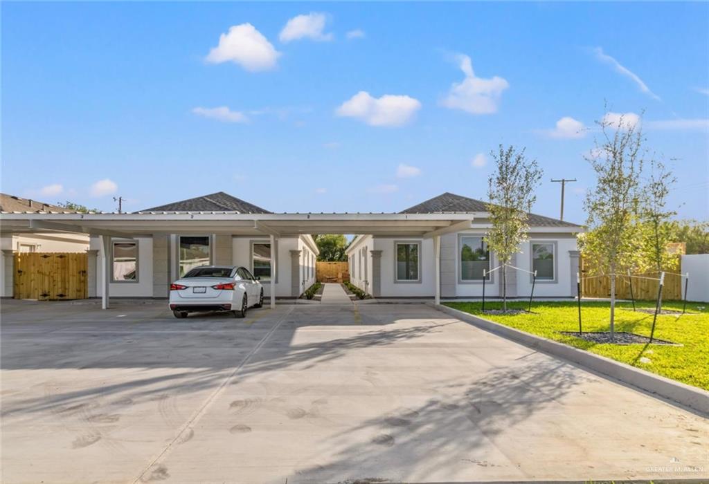 a view of house with outdoor space and swimming pool