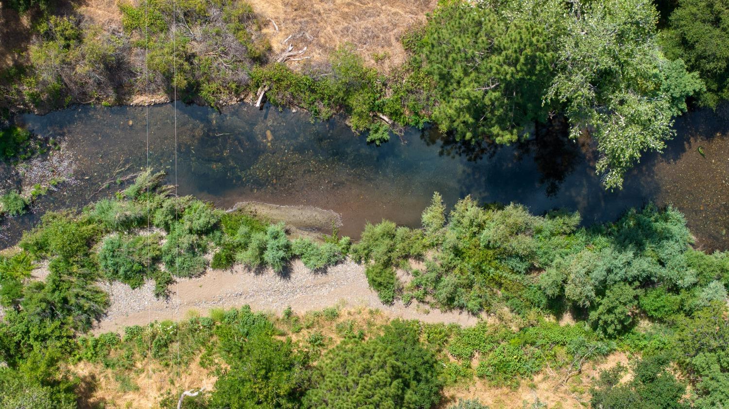 a view of a lake with a yard