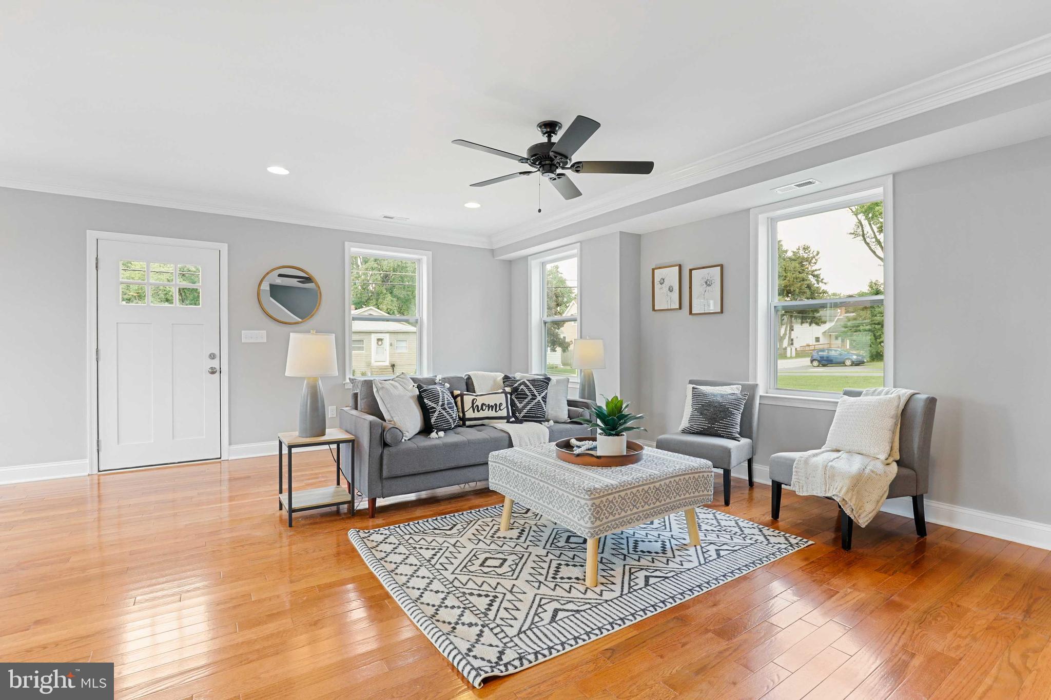 a living room with furniture and a rug