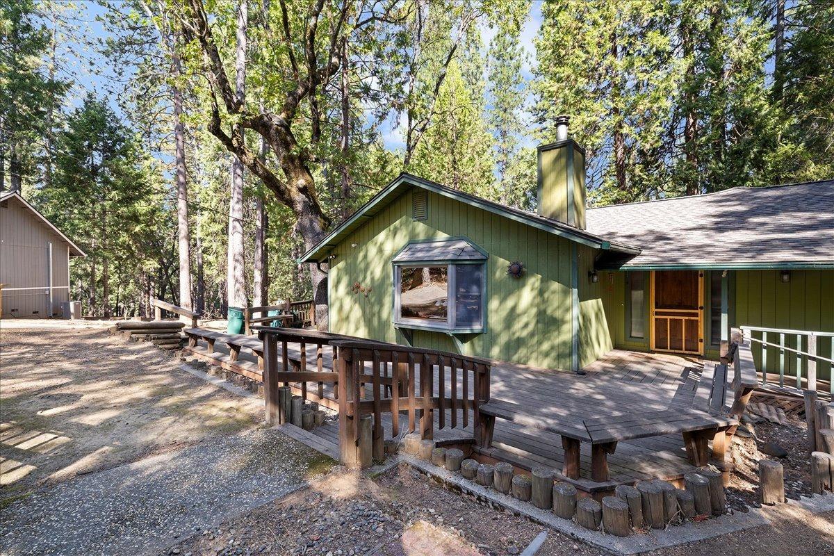 a view of house with outdoor seating area