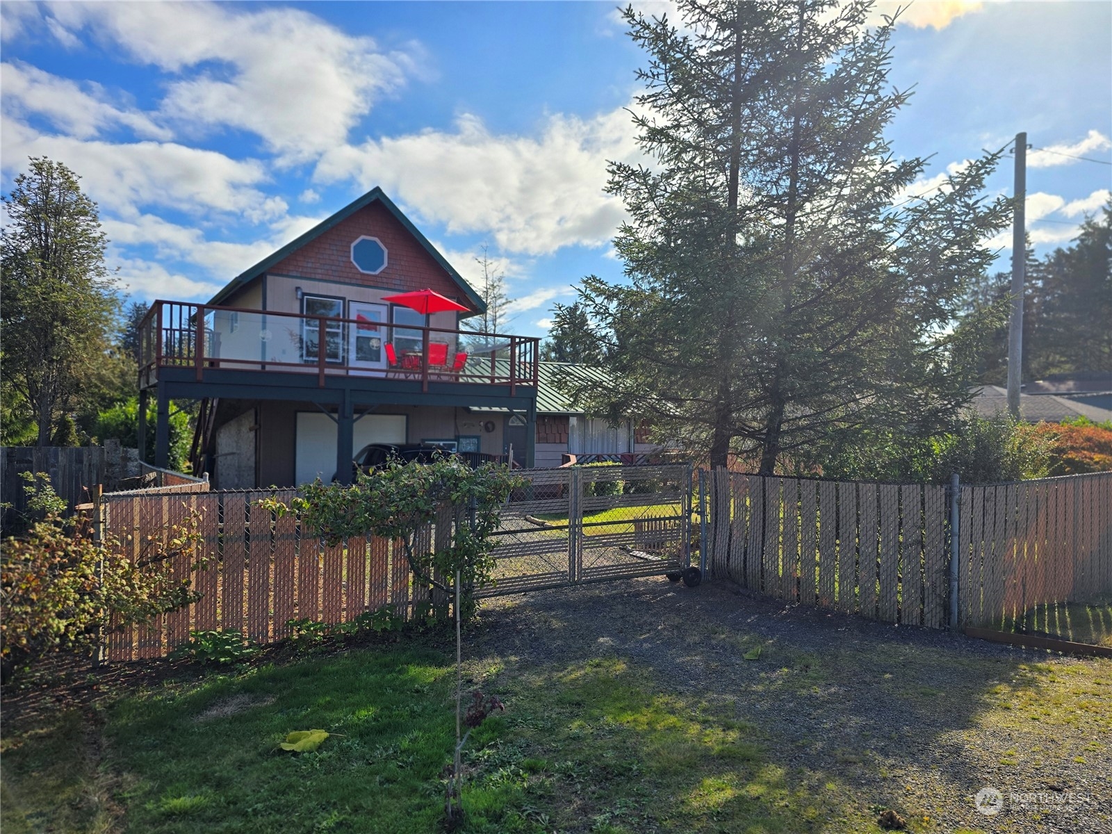 a view of house with outdoor space and garden