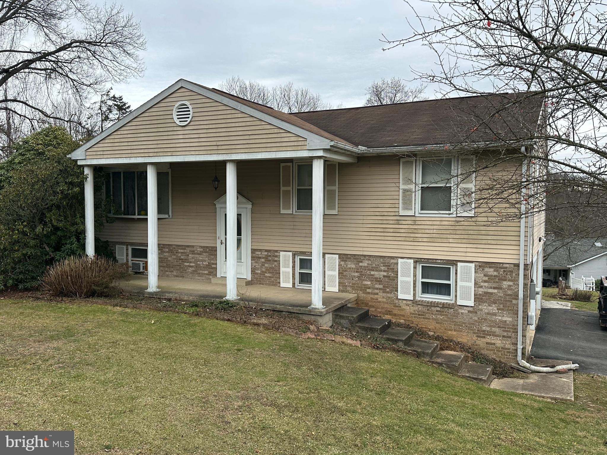 front view of a house with a yard