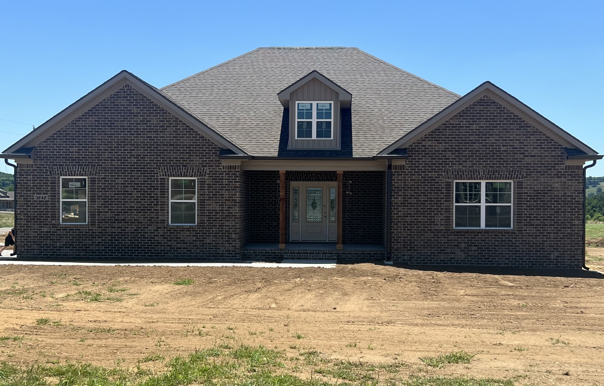 a front view of a house with a yard