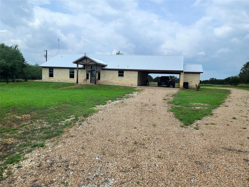 a view of house with yard and street