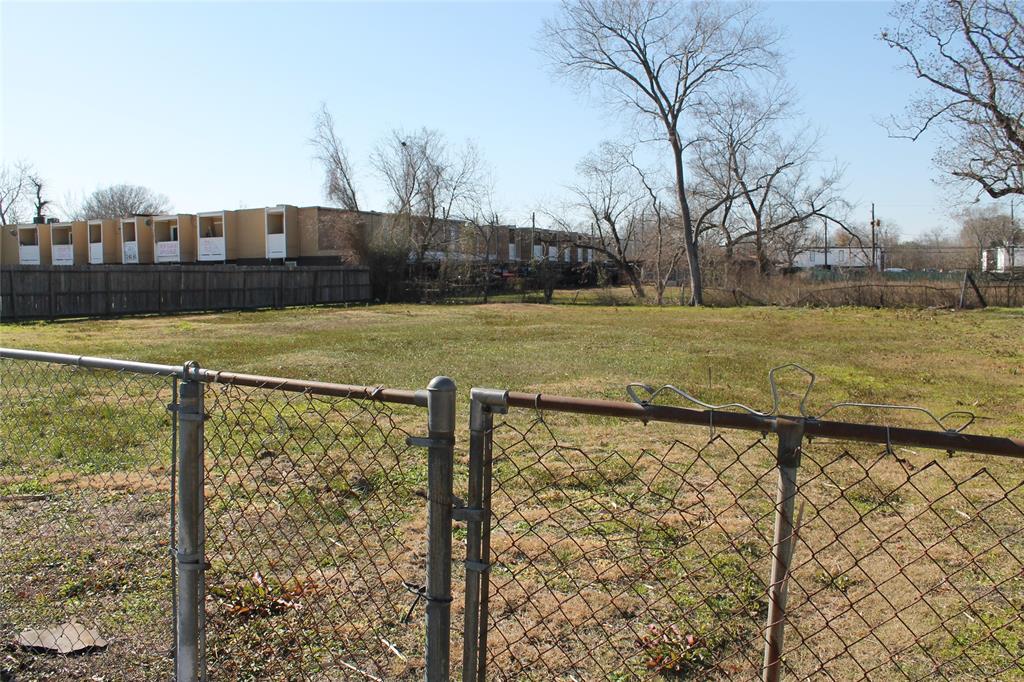 a view of a yard with an outdoor seating