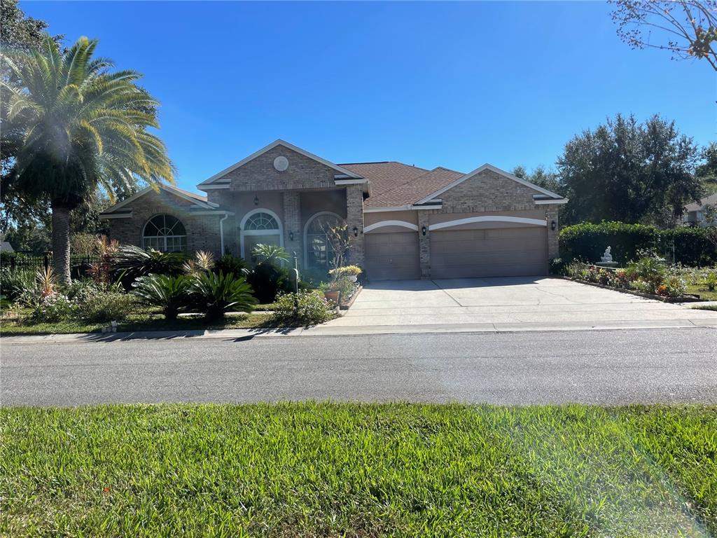 a front view of a house with a yard and garage