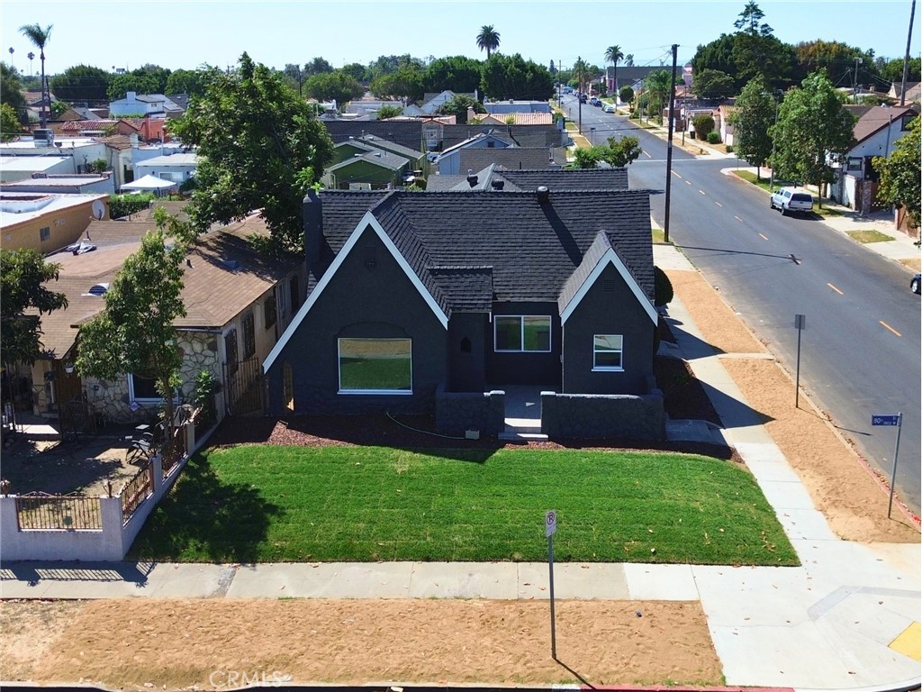 a aerial view of a house with a yard