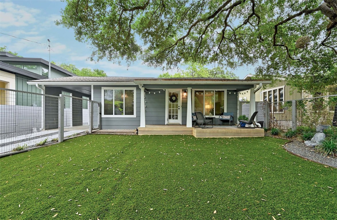 a front view of a house with a garden and patio