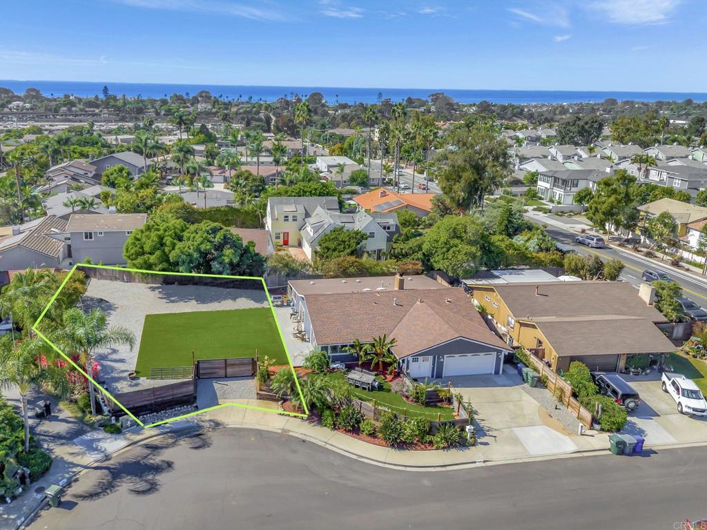 an aerial view of a house with a garden