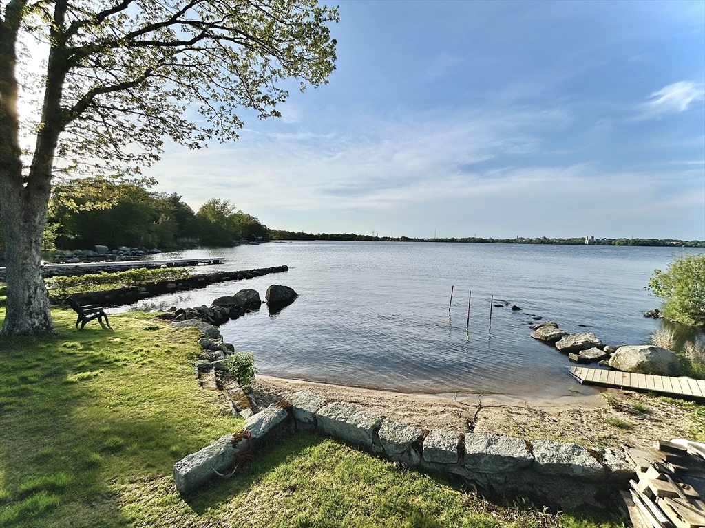 a view of a lake with a car parked