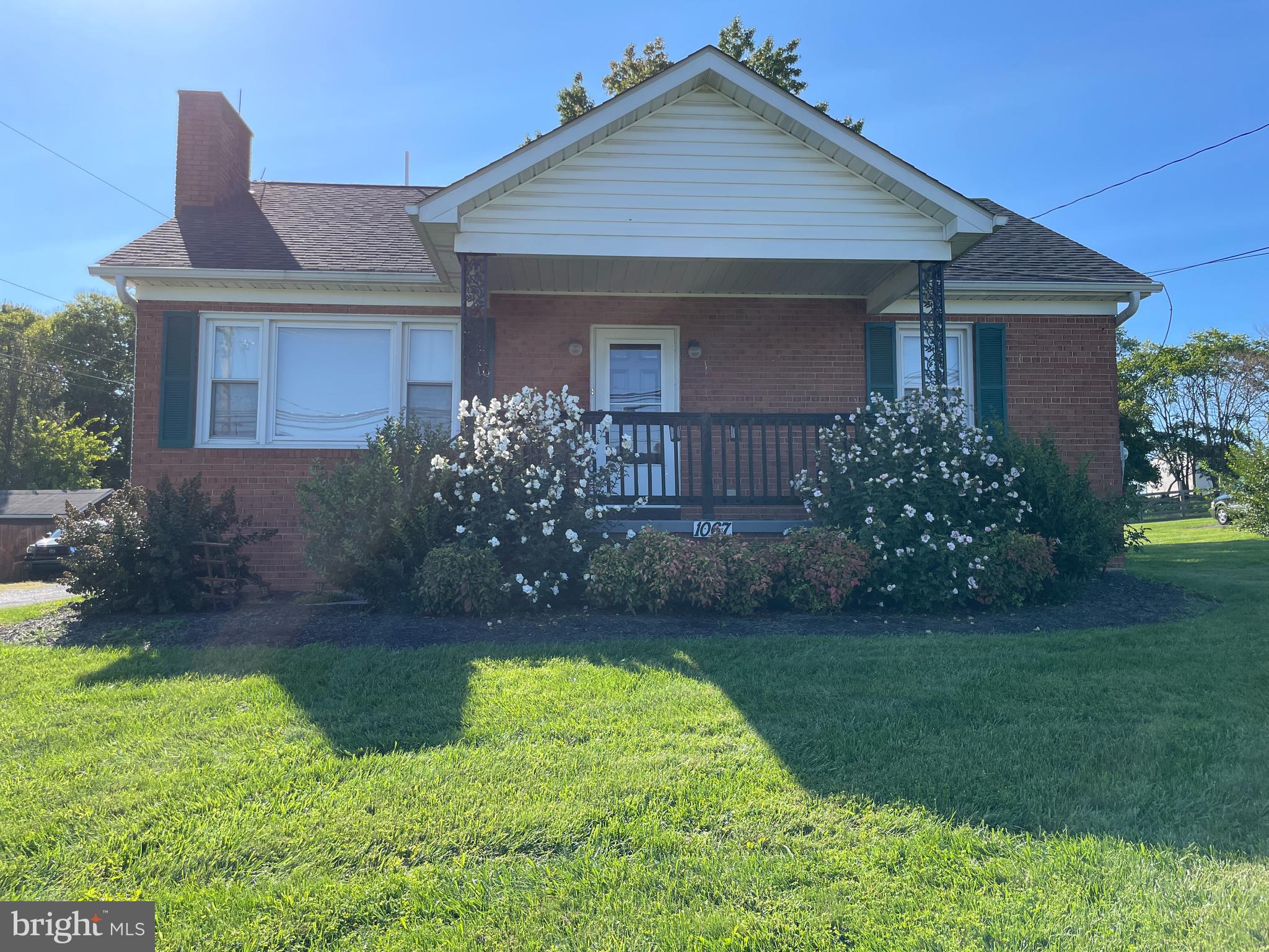 front view of a house and a yard