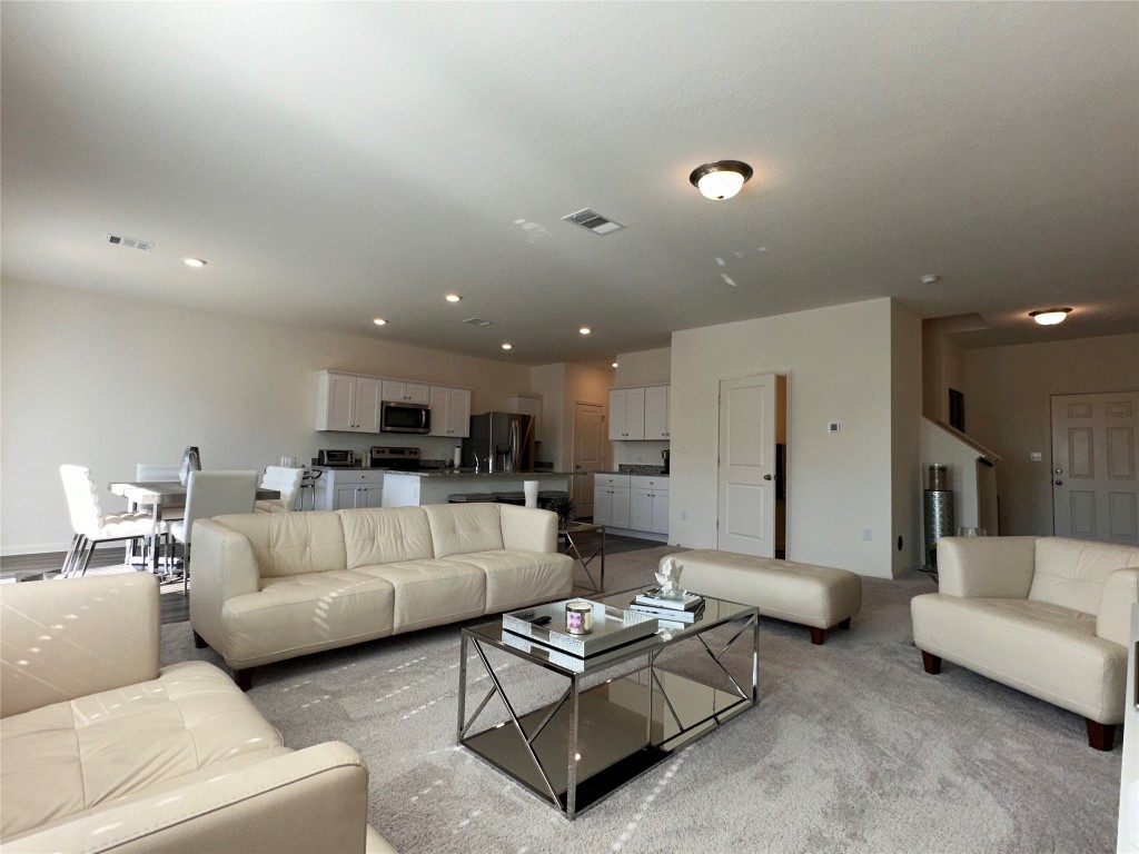 a living room with furniture and a couch