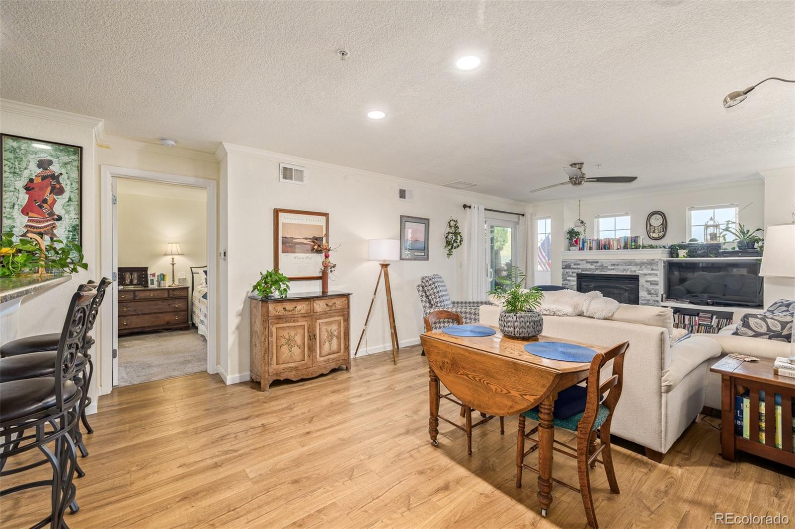 a view of a dining room with furniture and wooden floor