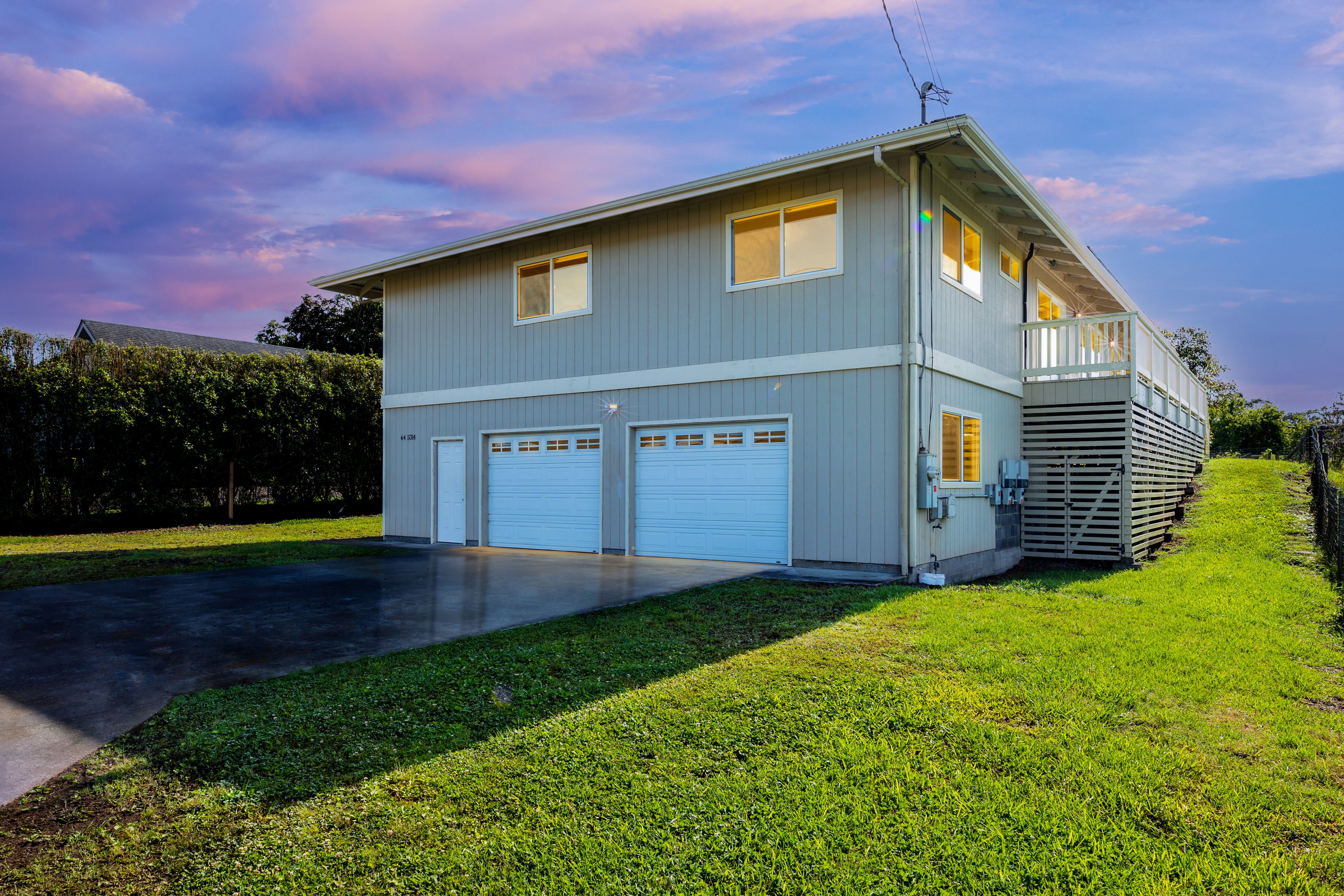 Large custom home with massive 874 SF garage area, owned PV and Mauna Kea views!