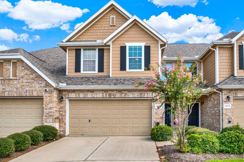 a front view of a house with garage