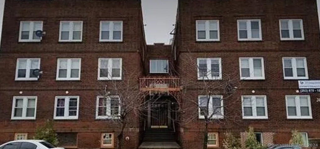 a front view of a building with many windows