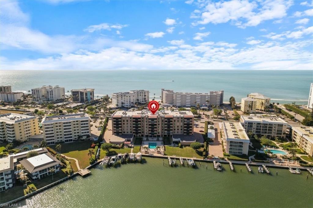 an aerial view of a city with ocean view