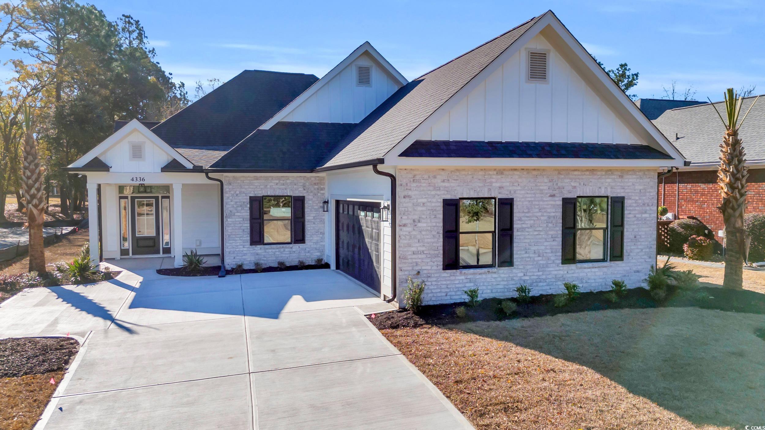 View of front of property with a garage