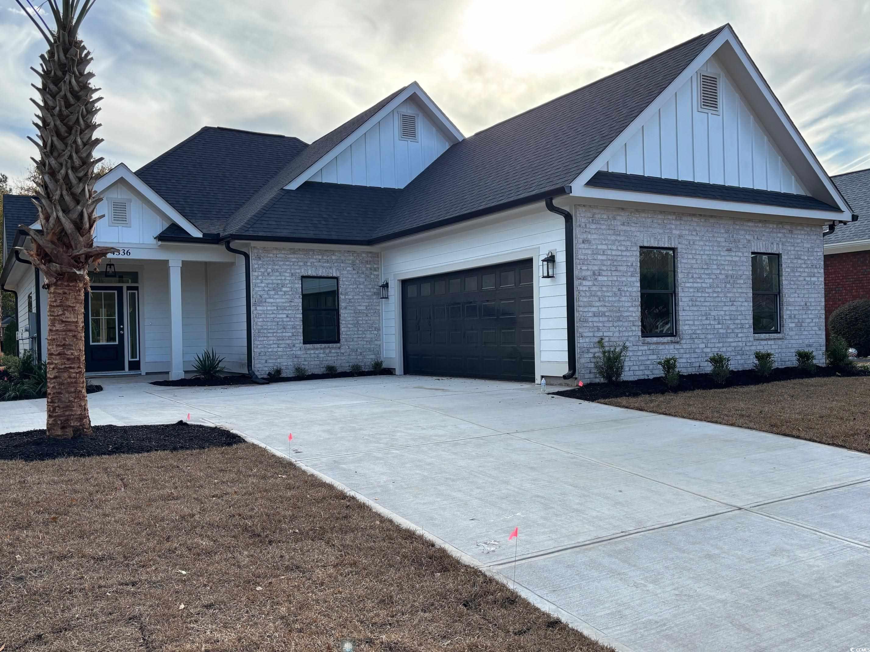 View of front of property featuring a garage