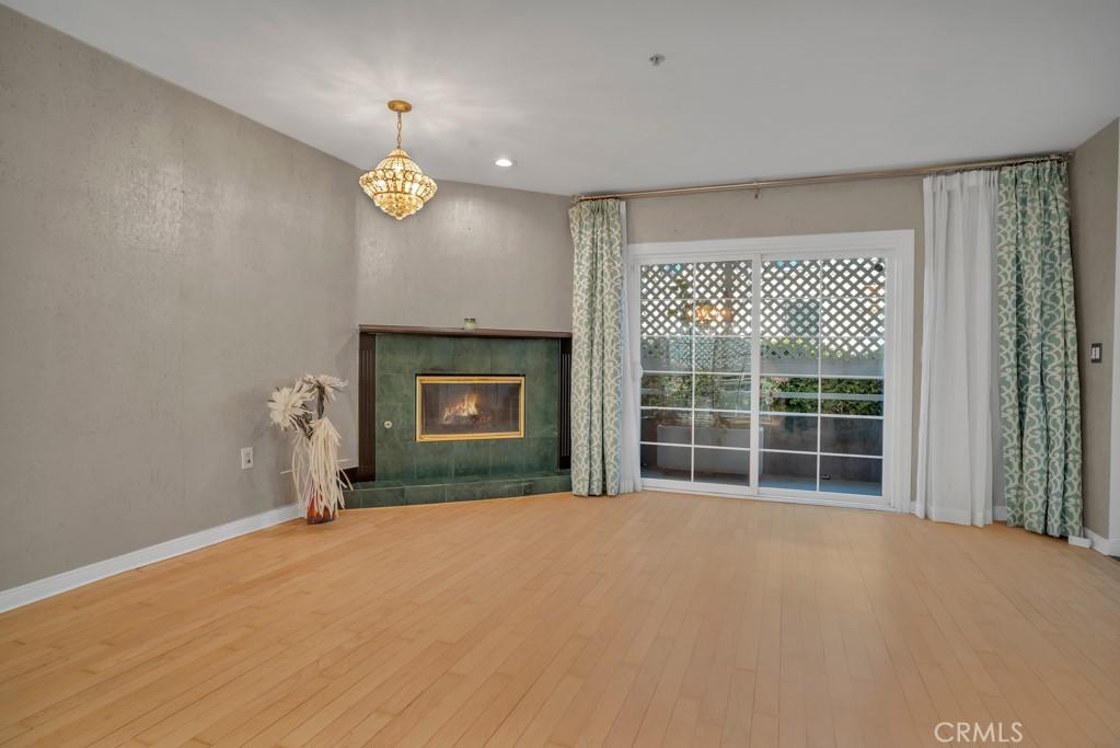 a view of empty room with a fireplace