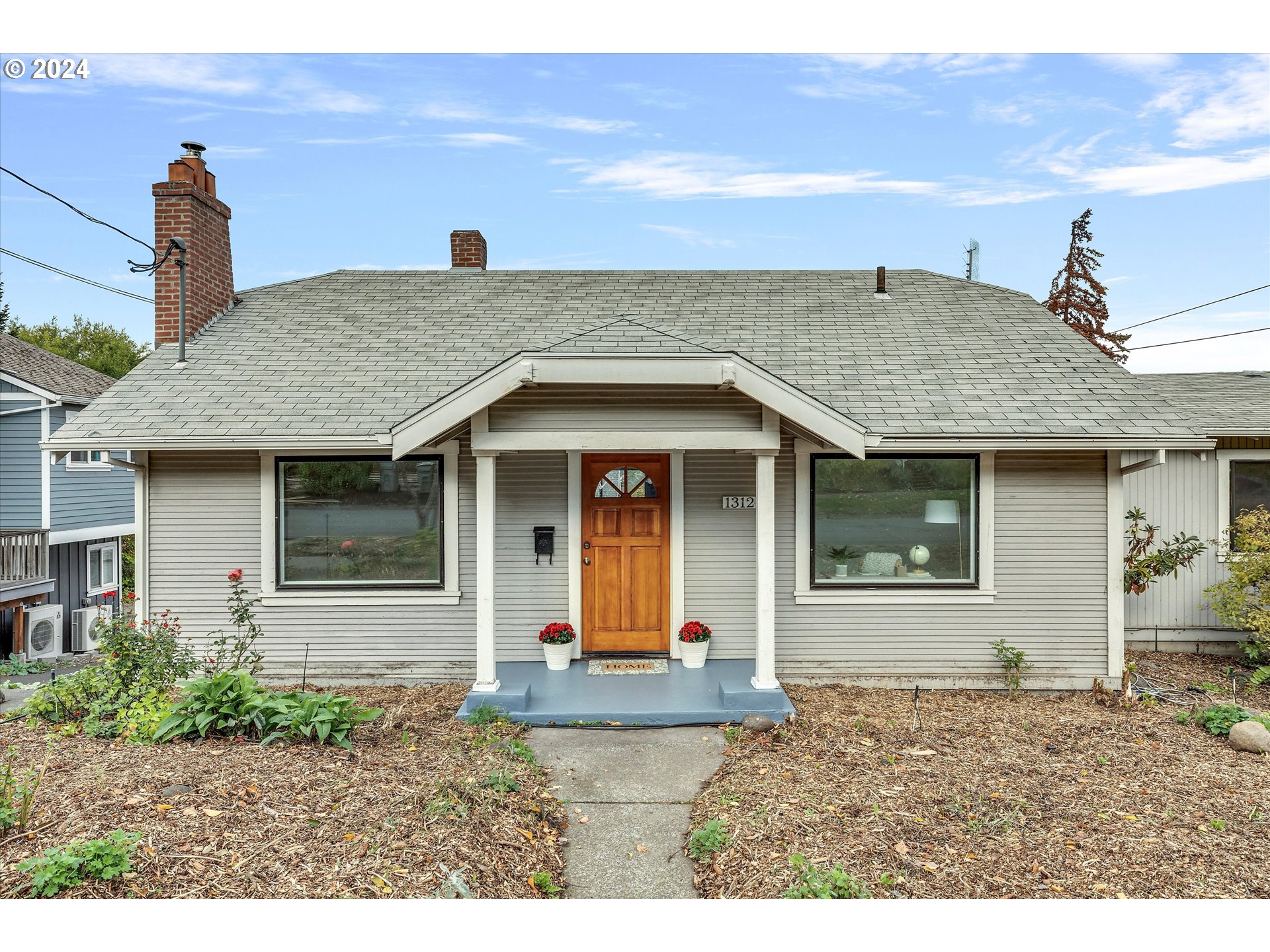 a view of house with yard