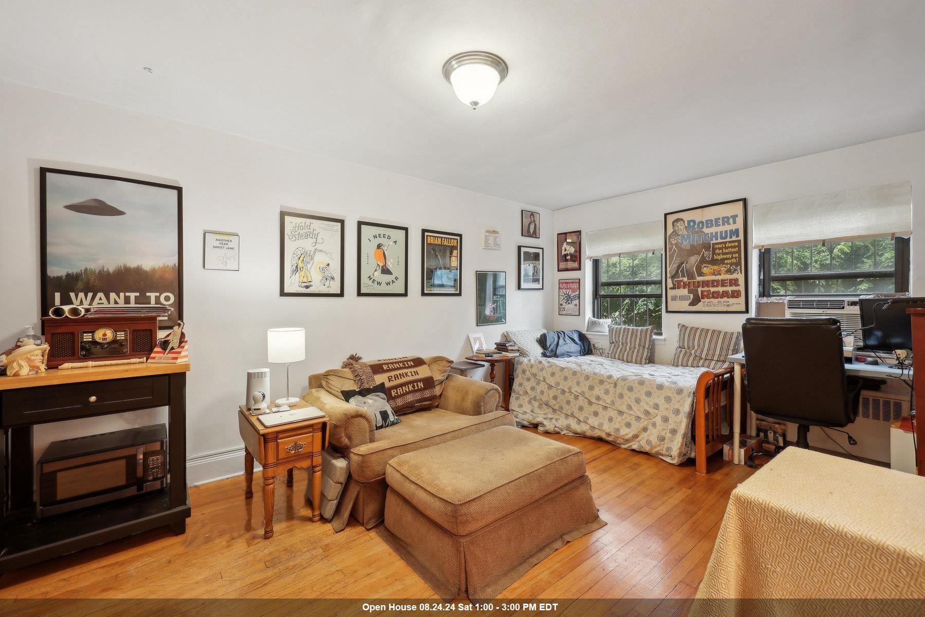 a living room with furniture flat screen tv and a fireplace