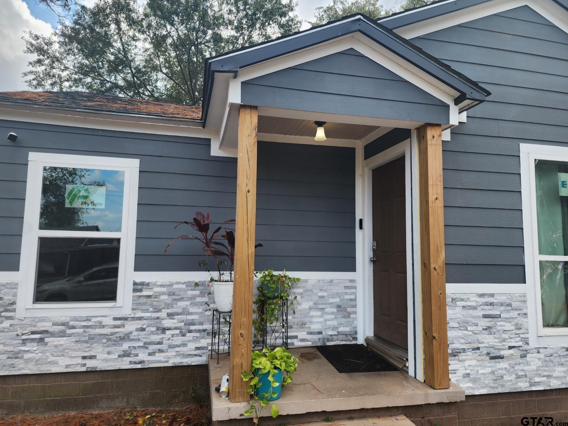 a front view of a house with garage