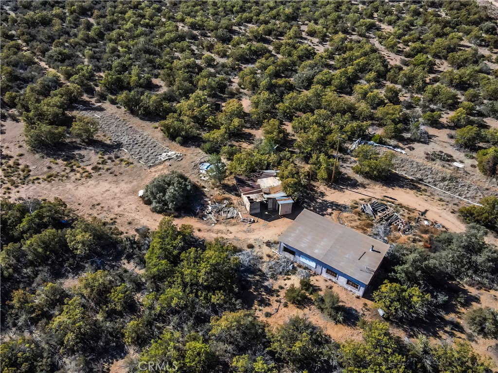 an aerial view of residential house with outdoor space